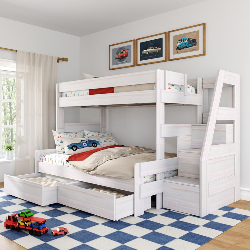 White wooden bunk bed with under-bed storage drawers and ladder, car-themed bedding and framed car prints in a bright modern kids' bedroom with toy cars on a blue check rug
