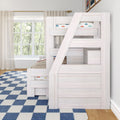 Whitewashed wooden bunk bed with integrated ladder and car-print bedding in a bright children's bedroom by a large window and blue check rug