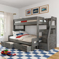 Gray wooden bunk bed with pull-out drawers, car-themed bedding and framed car prints in bright kids bedroom