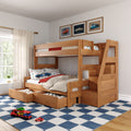 Wooden kids bunk bed with built-in storage drawers and staircase, car-themed bedding and framed vintage car prints in a bright children's bedroom