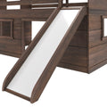 Close-up of dark walnut wooden loft bunk bed slide with white sliding surface, curved safety rails, visible hardware and solid wood construction