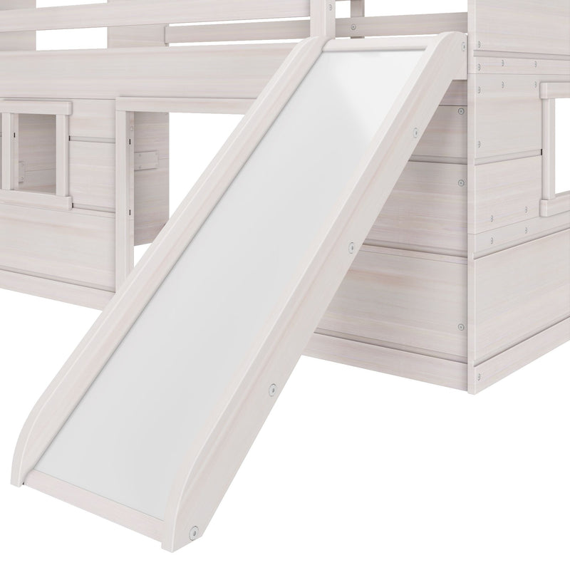 White wooden kids loft bed with integrated slide and ladder, close-up of modern children's bunk bed playhouse detailing
