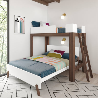 Modern walnut bunk bed with white guardrails and ladder, teal bedding and colorful pillows, pastel striped throw, wall sconces and geometric rug in bright kids' bedroom