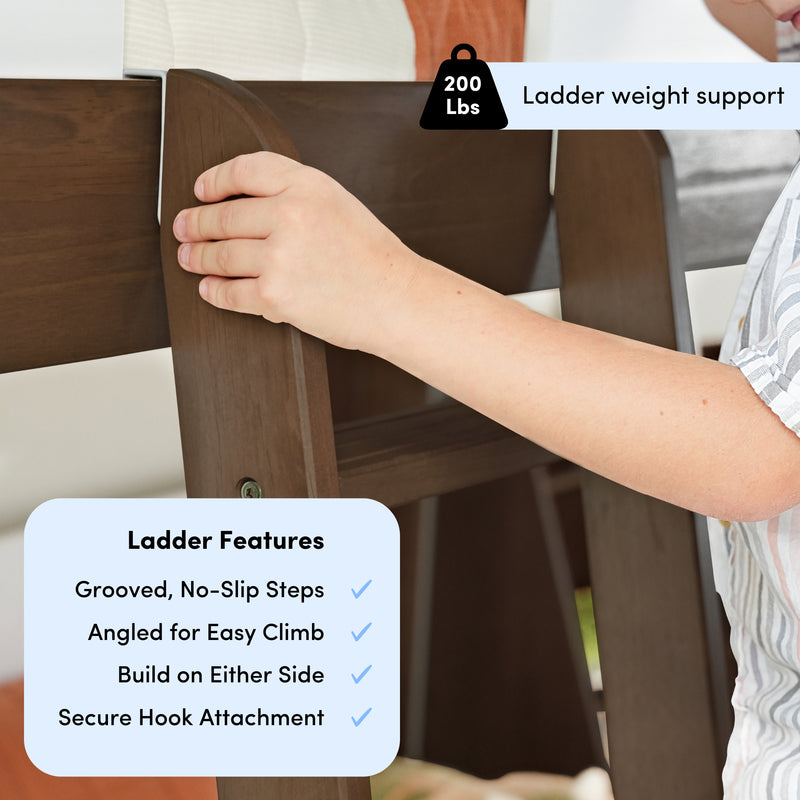 Dark brown wooden bunk bed ladder with grooved non-slip steps, secure hook attachment, angled for easy climb and 200 lb weight capacity, close-up hand adjusting ladder