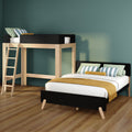 Modern wooden loft bed with ladder and lower twin bed in green-accent kids' bedroom with striped pillows and mustard throw blanket