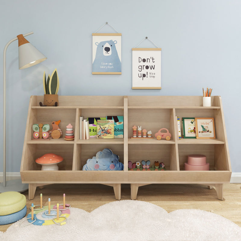 Nursery kids room decor with wooden cubby shelf, pastel Montessori toys and books, mushroom stool, cloud cushion and framed bear "Don't grow up" wall art