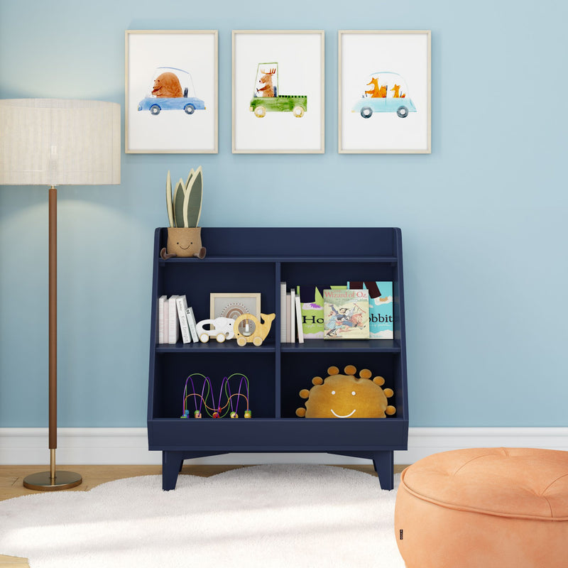 Nursery wall art: three framed whimsical animal car prints above a navy bookshelf with children's books, wooden toys and lamp — kids room decor, blue nursery