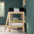 Natural wood loft bunk bed with ladder and black guard rails in teal bedroom, striped pillows and mustard throw