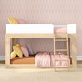 Wooden kids bunk bed with pink patterned wallpaper, pastel bedding, yellow and pink pillows and ladder