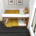 Modern wooden bunk bed with mustard yellow bedding and colorful pillows in a small kids' bedroom with white guardrails, abstract wall art, and a black-and-white striped rug