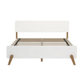 White mid-century modern platform bed frame with wooden angled legs, rectangular headboard and slatted wood mattress support, front view