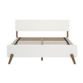 White mid-century modern platform bed frame with headboard, slatted wooden base and tapered walnut legs