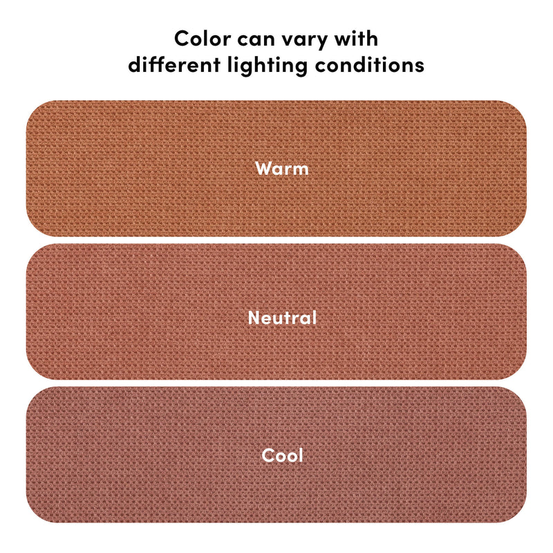 Close-up terracotta upholstery fabric samples showing woven texture and color variation under different lighting conditions labeled Warm, Neutral, Cool