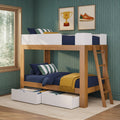 Kids wooden loft bunk bed with navy bedding and under-bed storage drawers in green wallpapered bedroom with framed wall art