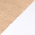 Minimalist light maple wood grain background with diagonal white paper for office desk flatlay