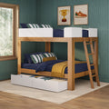 Wooden bunk bed with ladder and under-bed storage drawers, navy bedding and striped pillows in a green-walled kids' bedroom with framed wall art