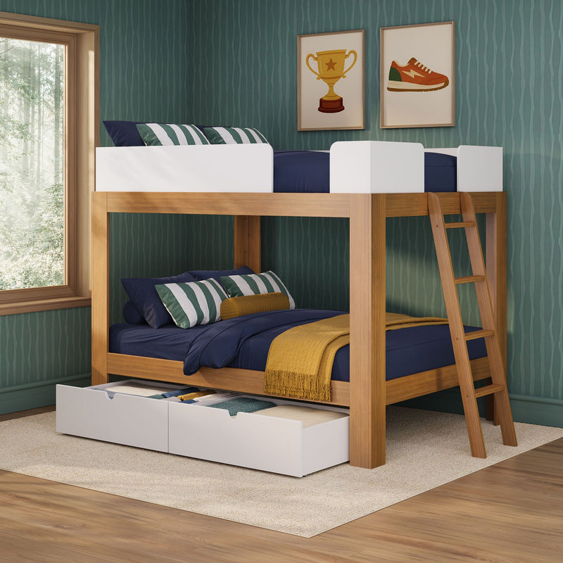 Wooden bunk bed with ladder and under-bed storage drawers, navy bedding and striped pillows in a green-walled kids' bedroom with framed wall art