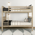 Natural wood bunk bed with ladder, black-and-white bedding and throw pillows, wall sconces and rug in a minimalist Scandinavian kids’ bedroom