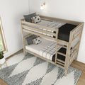 Natural wood bunk bed in modern minimalist kids bedroom with black-and-white bedding, patterned rug and wall sconce