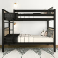 Space-saving modern black metal bunk bed with ladder, monochrome bedding and decorative pillows in a minimalist bedroom with wall sconces and patterned rug