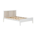 Minimalist white platform bed frame with vertical natural wood slat headboard and wooden slat mattress support