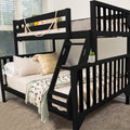 Black wooden twin-over-full bunk bed with angled ladder and guardrails, beige neutral bedding, textured throw pillows, decorative garland and succulent in a modern kids' bedroom