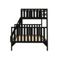 Black wooden loft bunk bed with ladder, vertical slatted guardrails and wooden slat mattress support — modern space‑saving kids bed