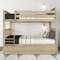 Solid wood bunk bed with ladder and under-bed storage, black-and-white bedding and wall sconces in modern kids bedroom
