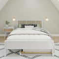Minimalist Scandinavian bedroom with white wooden bed frame, neutral bedding, green pillows, black patterned cushions, wall sconces and a white nightstand with plant