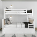 Modern white wooden bunk bed with ladder in a minimalist Scandinavian kids' bedroom, white bedding with patterned pillows, black knit throw and wall-mounted sconces