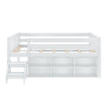 White wooden loft bed with guardrails, slatted mattress platform, built-in storage cubbies and attached staircase