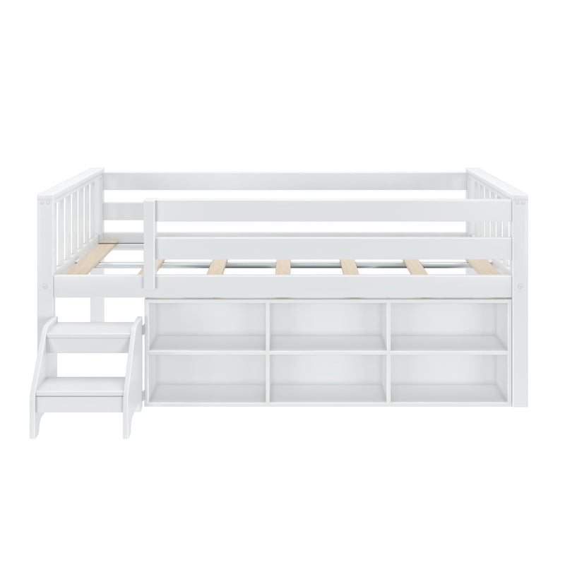White wooden loft bed with guardrails, slatted mattress platform, built-in storage cubbies and attached staircase