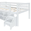 White kids loft bed with built-in storage cubbies and staircase drawers, slatted wooden mattress support and safety guardrails