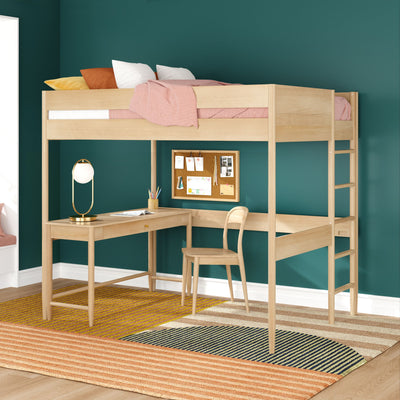 Loft bed with built-in desk and ladder, natural wood space-saving design with pink bedding and colorful pillows against a teal wall, study nook with corkboard, chair and lamp