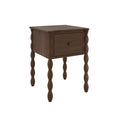 Dark brown wooden bedside table with turned spindle legs and single drawer — rustic modern nightstand