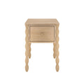 Light natural wood bedside table with single drawer and decorative turned spindle legs, farmhouse-style nightstand