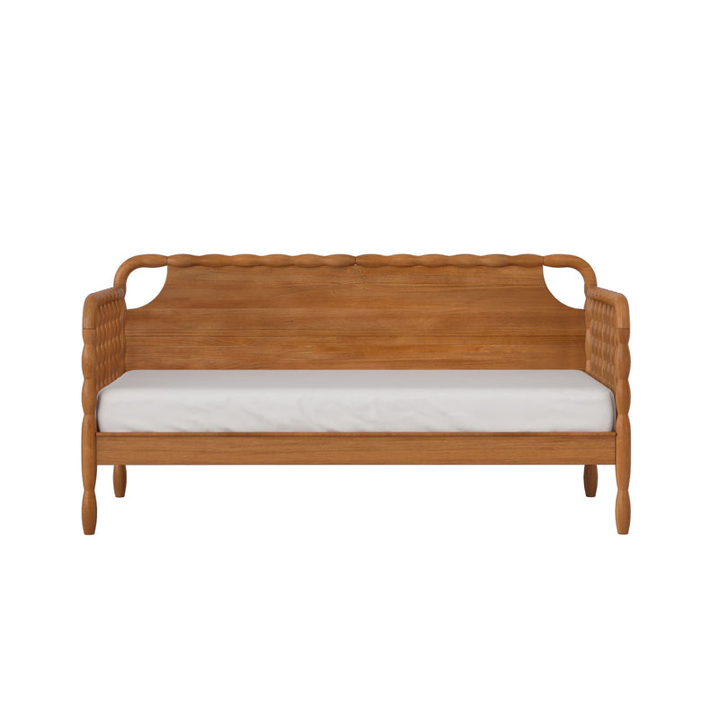 Front view of solid wood bed frame with carved headboard and woven side panels, white mattress, isolated on white background