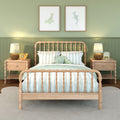 Kids coastal bedroom with wooden spindle bed, mint striped bedding, green paneled wall, bedside lamps and octopus plush