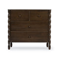 Dark brown wooden dresser with four drawers, turned legs and round knob handles, close-up front view on white background