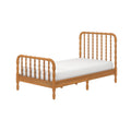 Natural oak wooden bed frame with turned spindle headboard and footboard and a white mattress, minimalist farmhouse bedroom furniture