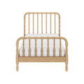 Natural light wood spindle bed frame with turned spindles, farmhouse-style headboard and footboard with white mattress