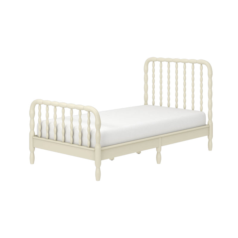 Cream ivory wooden twin bed with spindle headboard and footboard and white mattress, farmhouse-style bedroom