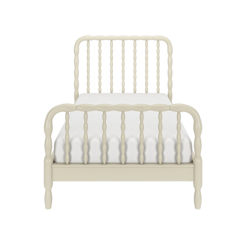 Cream painted spindle bed frame with white mattress, vintage farmhouse-style wooden headboard and footboard