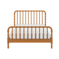 Wood spindle bed frame with carved rails and matching footboard in natural wood finish, front view with white mattress