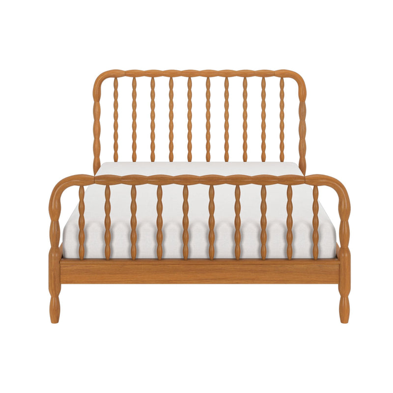 Wood spindle bed frame with carved rails and matching footboard in natural wood finish, front view with white mattress