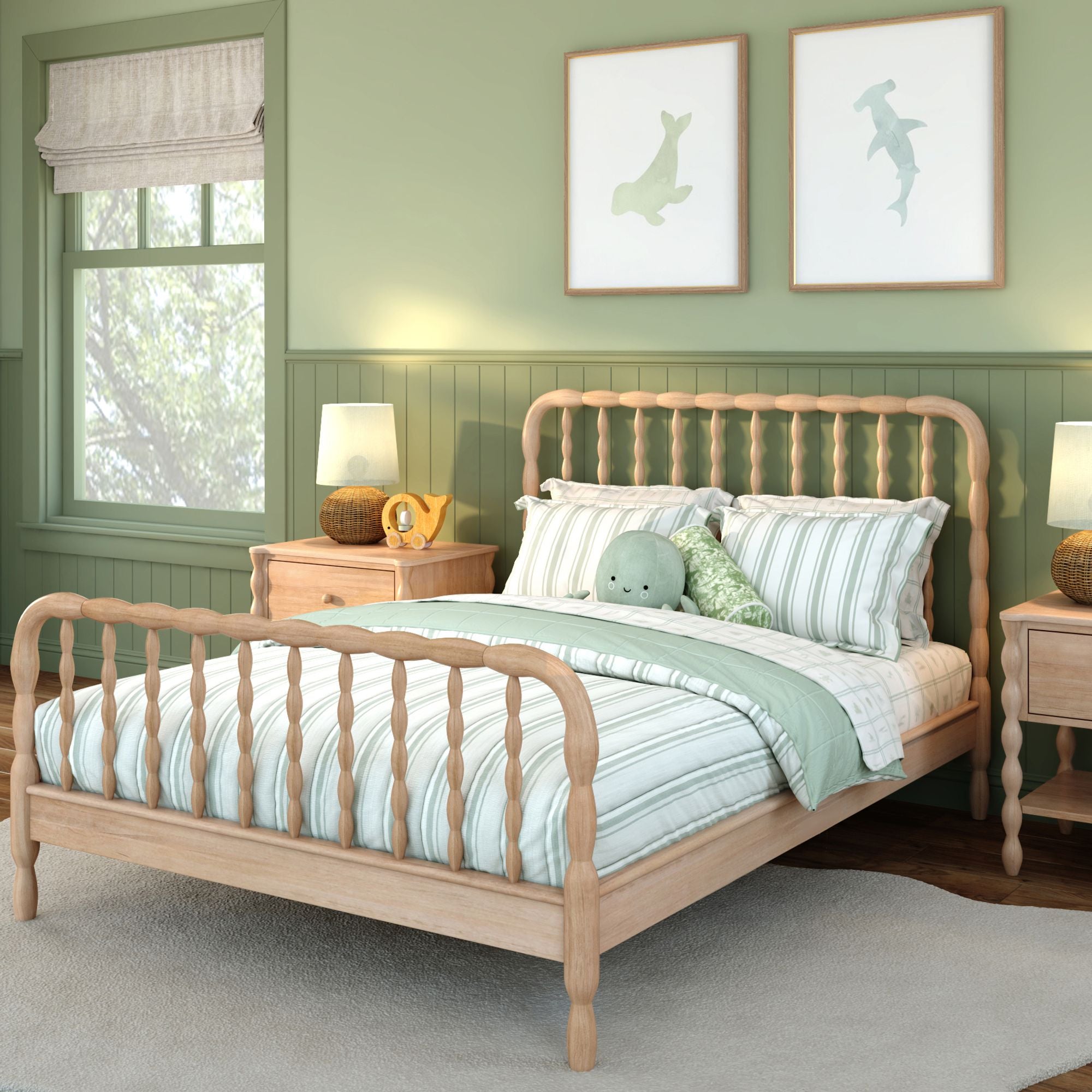 A light-wood finish Jenny Lind  full bed with green and white sheets in a green room. Matching nightstands are on either side of the bed.