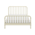 Ivory painted wooden spindle bed frame with turned-post headboard and footboard and white tufted mattress, farmhouse bedroom furniture