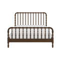 Brown wooden spindle bed frame with matching spindle headboard and footboard and white bedding, front view