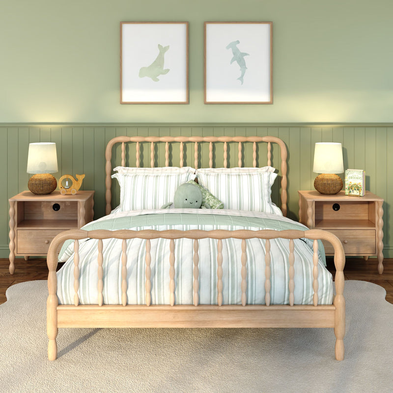 Cozy green nursery with wooden spindle bed, striped bedding, plush octopus toy, wicker lamps, matching nightstands and sea-animal wall art