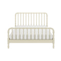 Cream wooden spindle bed frame with turned spindle headboard and footboard on white mattress, farmhouse vintage bedroom bed